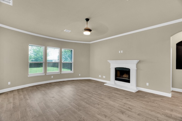 449 Hillstone Dr, Midlothian, TX 76065 - unfurnished living room featuring ornamental molding, wood finished floors, ceiling fan, baseboards, and a fireplace with raised hearth