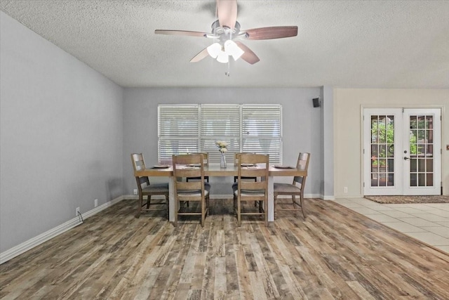 4325 Falcon Dr, Sherman, TX 75092 - dining room with a textured ceiling, french doors, a ceiling fan, wood finished floors, and baseboards