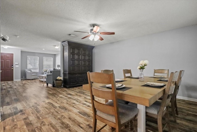 4325 Falcon Dr, Sherman, TX 75092 - dining room featuring wood finished floors, a textured ceiling, ceiling fan, and baseboards