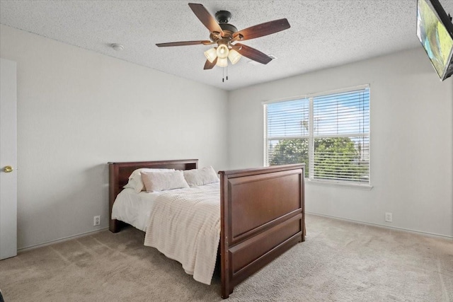 4325 Falcon Dr, Sherman, TX 75092 - bedroom with light carpet, a textured ceiling, ceiling fan, and baseboards
