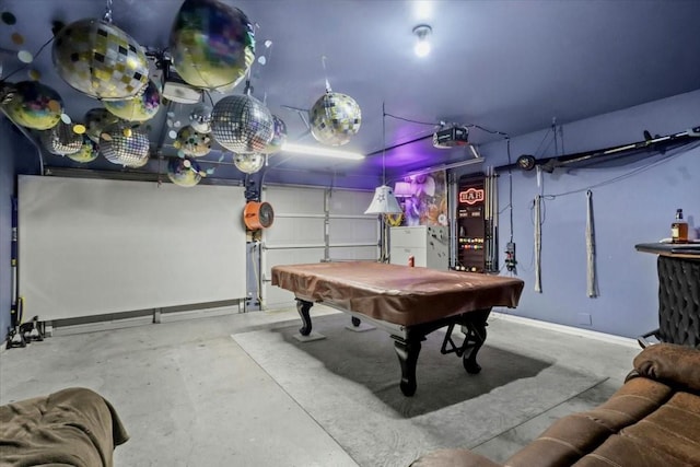 4325 Falcon Dr, Sherman, TX 75092 - playroom with concrete floors, pool table, baseboards, and a garage