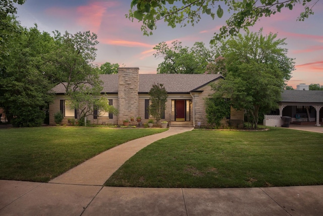 1125 Sayles Blvd, Abilene, TX 79605 - mid-century home featuring a lawn, a chimney, and roof with shingles