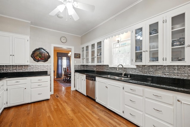 1125 Sayles Blvd, Abilene, TX 79605 - kitchen with a sink, dishwasher, white cabinetry, and crown molding