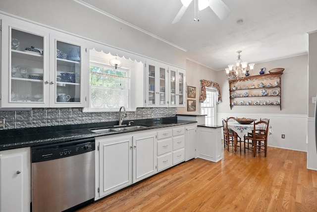 1125 Sayles Blvd, Abilene, TX 79605 - kitchen featuring dishwasher, a sink, dark countertops, a chandelier, and white cabinets