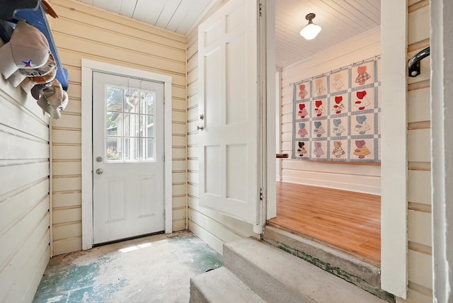 1125 Sayles Blvd, Abilene, TX 79605 - doorway with wooden walls, wooden ceiling, and concrete floors