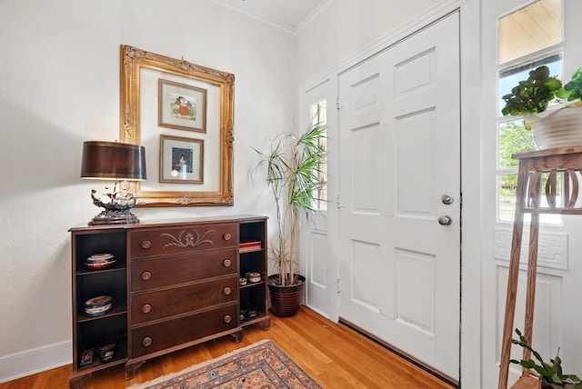 1125 Sayles Blvd, Abilene, TX 79605 - foyer with light wood-style floors and ornamental molding