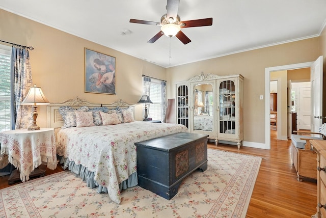 1125 Sayles Blvd, Abilene, TX 79605 - bedroom featuring wood finished floors, ornamental molding, baseboards, and ceiling fan