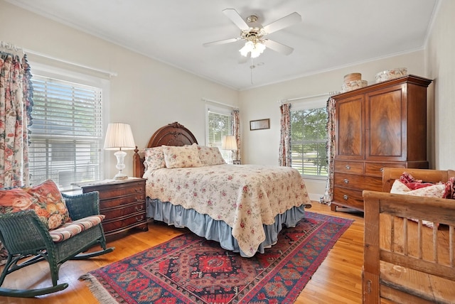 1125 Sayles Blvd, Abilene, TX 79605 - bedroom featuring light wood-style flooring, ornamental molding, and ceiling fan