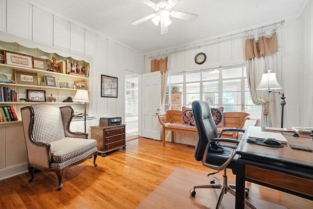 1125 Sayles Blvd, Abilene, TX 79605 - home office with a ceiling fan, light wood-type flooring, ornamental molding, and a decorative wall