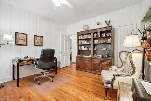 1125 Sayles Blvd, Abilene, TX 79605 - home office with ceiling fan, light wood-style flooring, and a decorative wall