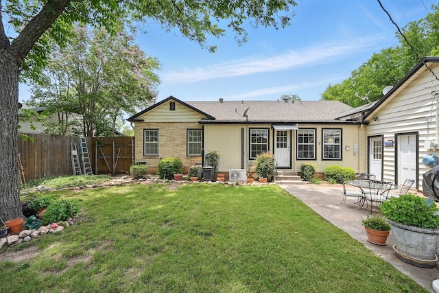 1125 Sayles Blvd, Abilene, TX 79605 - rear view of house featuring entry steps, a patio area, a cooling unit, and a shingled roof