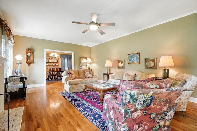 1125 Sayles Blvd, Abilene, TX 79605 - living area with a chandelier, baseboards, wood finished floors, a ceiling fan, and ornamental molding