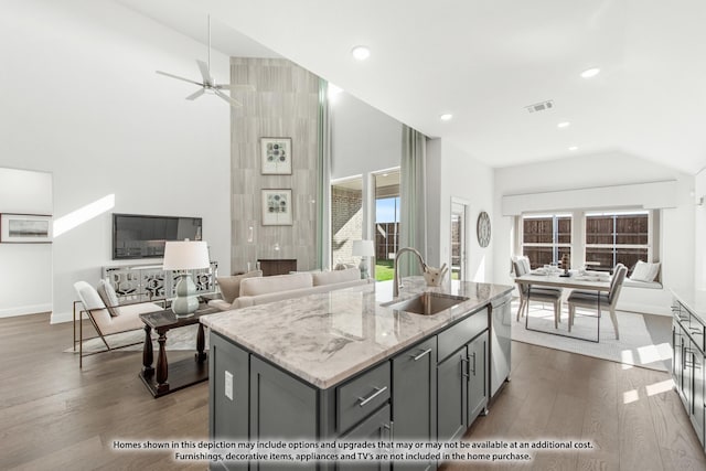 4031 Zina Ln, Prosper, TX 75078 - kitchen featuring a sink, gray cabinetry, high vaulted ceiling, light stone countertops, and dark wood finished floors