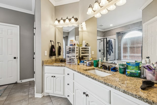 412 Kyle Ln, Lewisville, TX 75067 - bathroom with crown molding, double vanity, a shower stall, and tile patterned floors