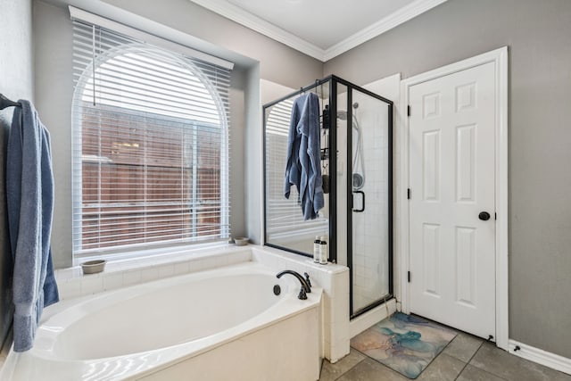 412 Kyle Ln, Lewisville, TX 75067 - bathroom with a garden tub, a shower stall, plenty of natural light, ornamental molding, and baseboards