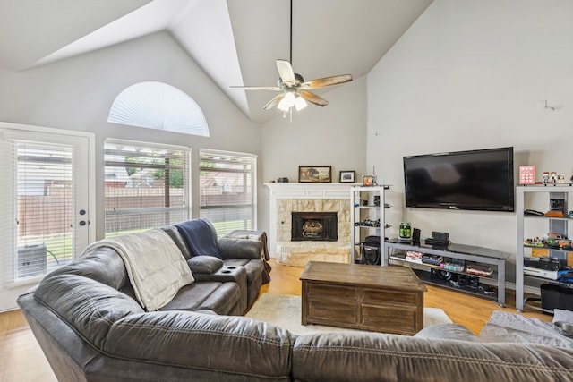 412 Kyle Ln, Lewisville, TX 75067 - living area with a ceiling fan, wood finished floors, high vaulted ceiling, and a fireplace with raised hearth