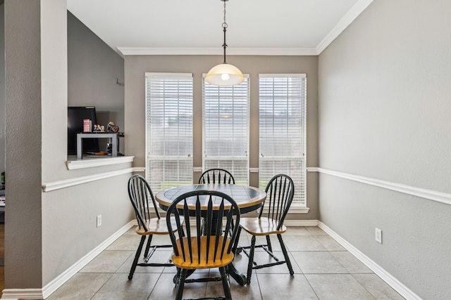 412 Kyle Ln, Lewisville, TX 75067 - dining space with plenty of natural light, tile patterned flooring, crown molding, and baseboards