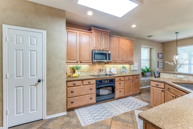 12744 Concho Dr, Frisco, TX 75033 - kitchen featuring oven, stainless steel microwave, pendant lighting, light stone counters, and recessed lighting