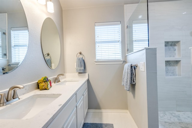 12744 Concho Dr, Frisco, TX 75033 - bathroom with double vanity, walk in shower, and baseboards