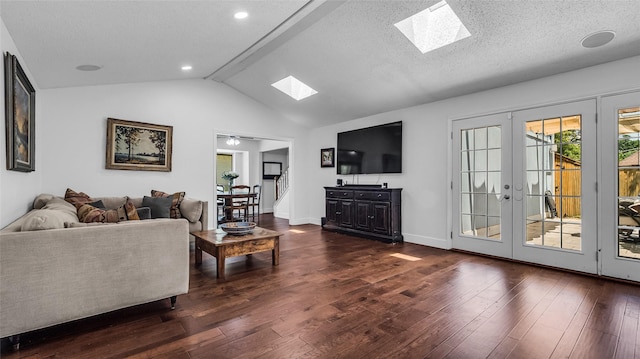 8534 Vista View Dr, Dallas, TX 75243 - living area with a skylight, vaulted ceiling, french doors, dark wood-style floors, and baseboards