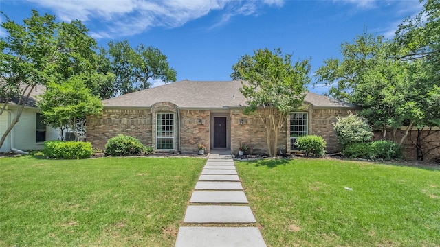 8534 Vista View Dr, Dallas, TX 75243 - ranch-style house with a front yard, brick siding, and a shingled roof