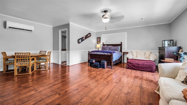 8534 Vista View Dr, Dallas, TX 75243 - bedroom featuring a wall mounted AC, wainscoting, wood finished floors, ornamental molding, and a ceiling fan