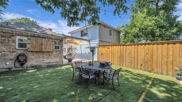 8534 Vista View Dr, Dallas, TX 75243 - view of yard featuring a patio and outdoor dining area