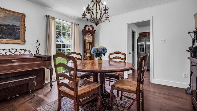 8534 Vista View Dr, Dallas, TX 75243 - dining room featuring a chandelier, a textured ceiling, dark wood-style floors, baseboards, and ornamental molding