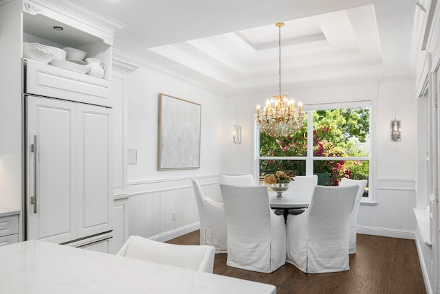 4009 Tave Ct, Arlington, TX 76016 - dining area featuring a chandelier, a tray ceiling, dark wood-style floors, a wainscoted wall, and a decorative wall