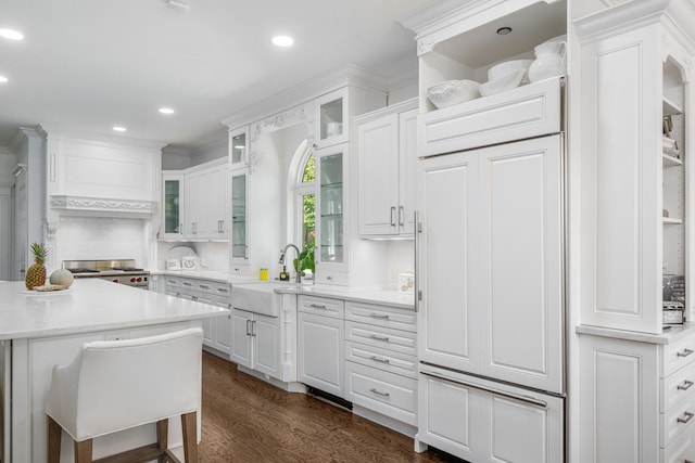 4009 Tave Ct, Arlington, TX 76016 - kitchen with a sink, gas stove, white cabinets, light countertops, and dark wood finished floors