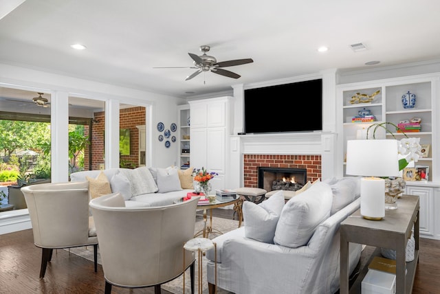 4009 Tave Ct, Arlington, TX 76016 - living room with ceiling fan, dark wood-type flooring, a brick fireplace, and built in shelves