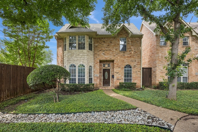 5836 Oram St, Dallas, TX 75206 - view of front facade featuring brick siding, roof with shingles, and stone siding