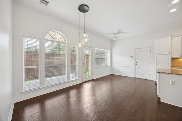 5836 Oram St, Dallas, TX 75206 - unfurnished dining area with dark wood finished floors, a ceiling fan, baseboards, ornamental molding, and recessed lighting