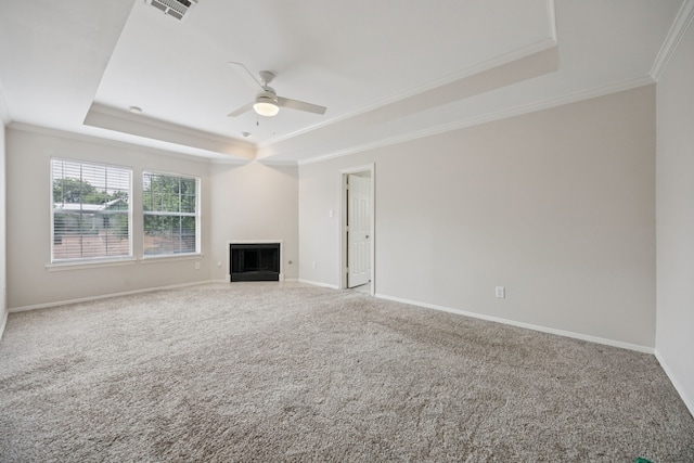5836 Oram St, Dallas, TX 75206 - unfurnished living room featuring a raised ceiling, crown molding, a ceiling fan, carpet flooring, and a fireplace