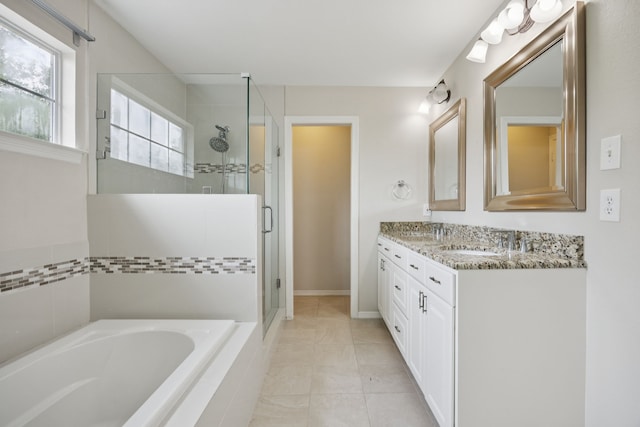 5836 Oram St, Dallas, TX 75206 - full bathroom with a stall shower, a garden tub, double vanity, and plenty of natural light