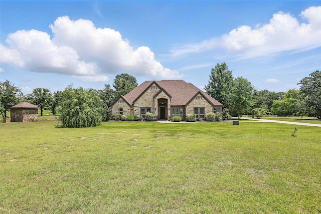 209 Ellis Creek Dr, Weatherford, TX 76085 - french country style house with stone siding and a front lawn