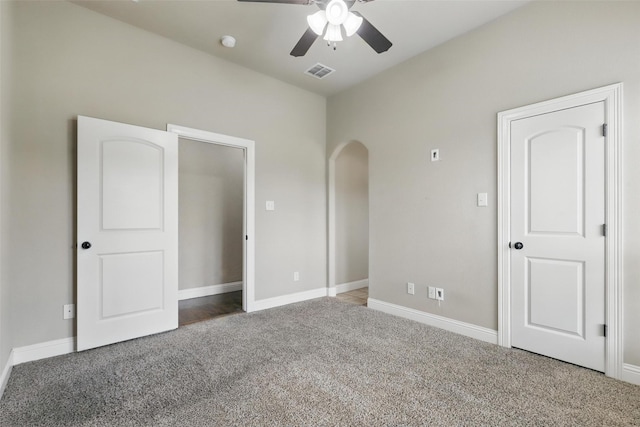 209 Ellis Creek Dr, Weatherford, TX 76085 - unfurnished bedroom featuring carpet flooring, arched walkways, and baseboards