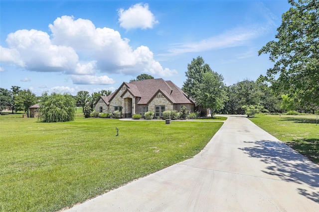 209 Ellis Creek Dr, Weatherford, TX 76085 - french country home featuring stone siding and a front yard