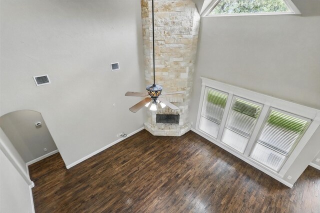 209 Ellis Creek Dr, Weatherford, TX 76085 - unfurnished living room featuring a ceiling fan, wood finished floors, a high ceiling, and baseboards