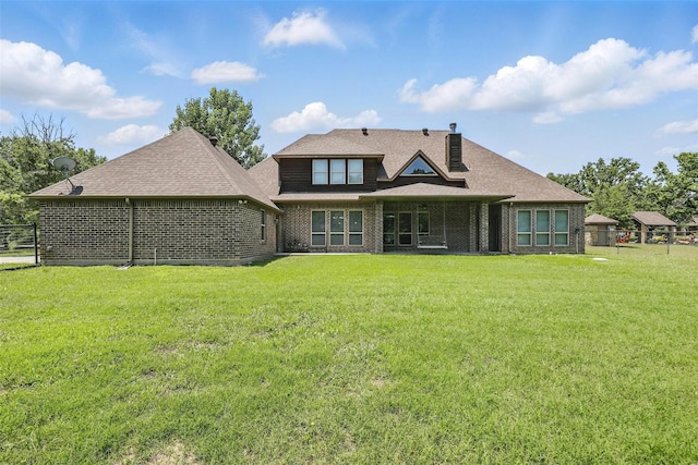 209 Ellis Creek Dr, Weatherford, TX 76085 - rear view of house with brick siding and roof with shingles