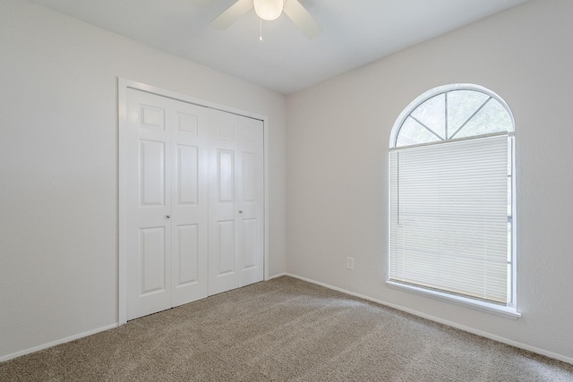 7108 Christie Ln, Dallas, TX 75249 - unfurnished bedroom with carpet, a closet, a ceiling fan, and baseboards