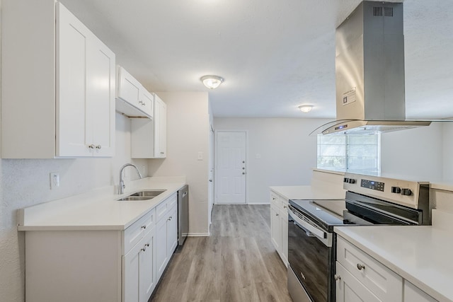 7108 Christie Ln, Dallas, TX 75249 - kitchen featuring appliances with stainless steel finishes, a sink, island range hood, light wood-style floors, and light countertops
