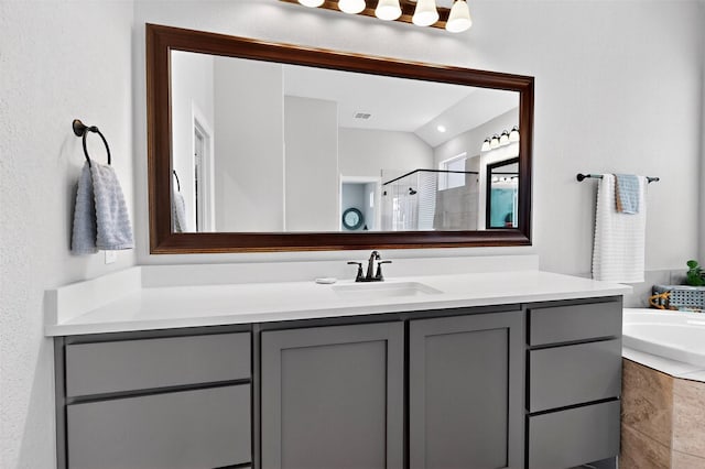 734 Oakleaf Dr, Midlothian, TX 76065 - bathroom with vanity, a shower stall, a bath, and lofted ceiling