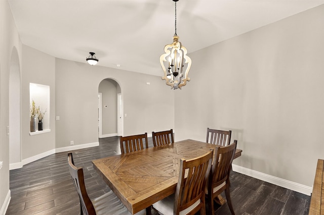 734 Oakleaf Dr, Midlothian, TX 76065 - dining room with arched walkways, a chandelier, dark wood-style flooring, and baseboards
