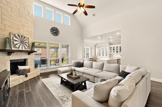 734 Oakleaf Dr, Midlothian, TX 76065 - living area featuring a ceiling fan, dark wood finished floors, a fireplace, high vaulted ceiling, and baseboards