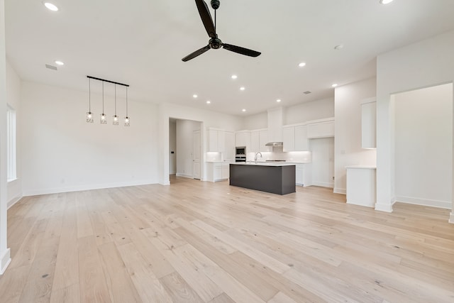 609 Cork Dr, Celina, TX 75009 - unfurnished living room with a ceiling fan, light wood-style floors, and recessed lighting