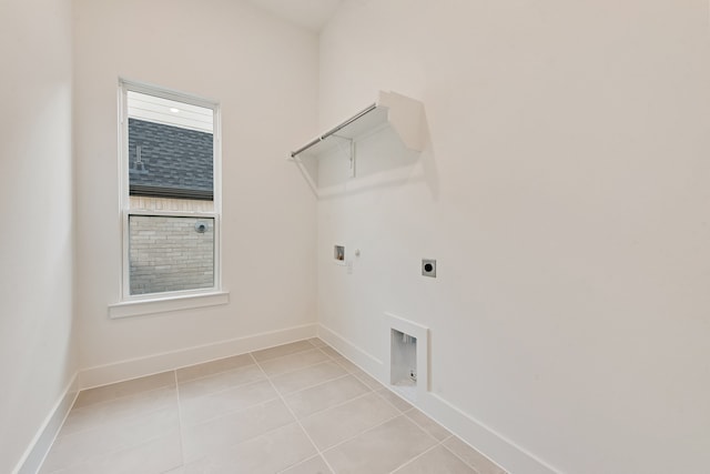 609 Cork Dr, Celina, TX 75009 - laundry room with hookup for an electric dryer, gas dryer hookup, washer hookup, and light tile patterned floors