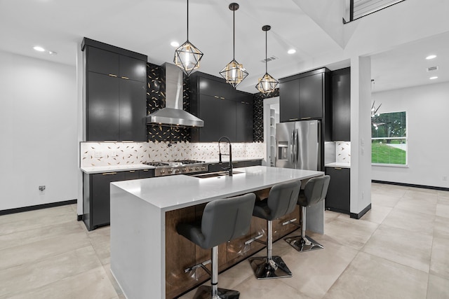 2303 Timber Creek Ct, Cedar Hill, TX 75104 - kitchen with dark cabinets, wall chimney range hood, appliances with stainless steel finishes, a sink, and backsplash
