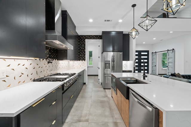 2303 Timber Creek Ct, Cedar Hill, TX 75104 - kitchen with modern cabinets, dark cabinetry, stainless steel appliances, wall chimney exhaust hood, and recessed lighting