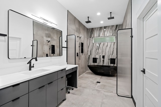 2303 Timber Creek Ct, Cedar Hill, TX 75104 - bathroom featuring vanity, a soaking tub, walk in shower, and recessed lighting